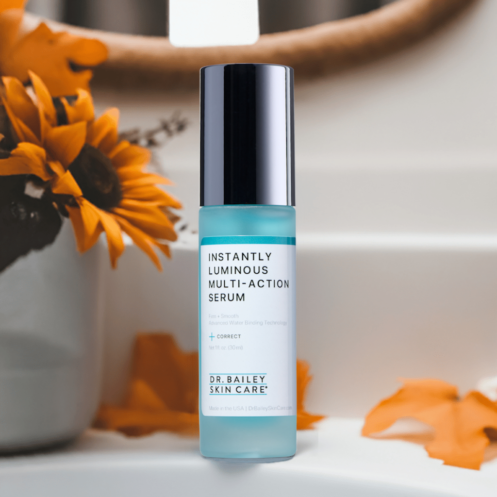 Instantly Luminous Multi-Action Serum in a bathroom with a fall theme